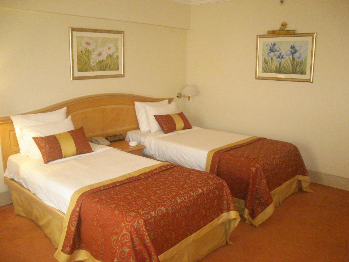 Hotel Ramada Plaza By Wyndham Palm Grove Bombay Exterior foto A room at the hotel